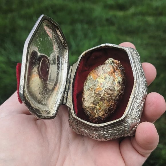 Gilded opossums heart in vintage jewelry casket box